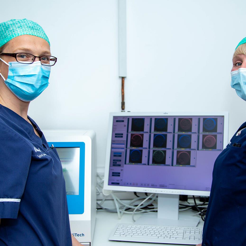 Gateshead Fertility: Two doctors wearing masks stand beside a computer screen